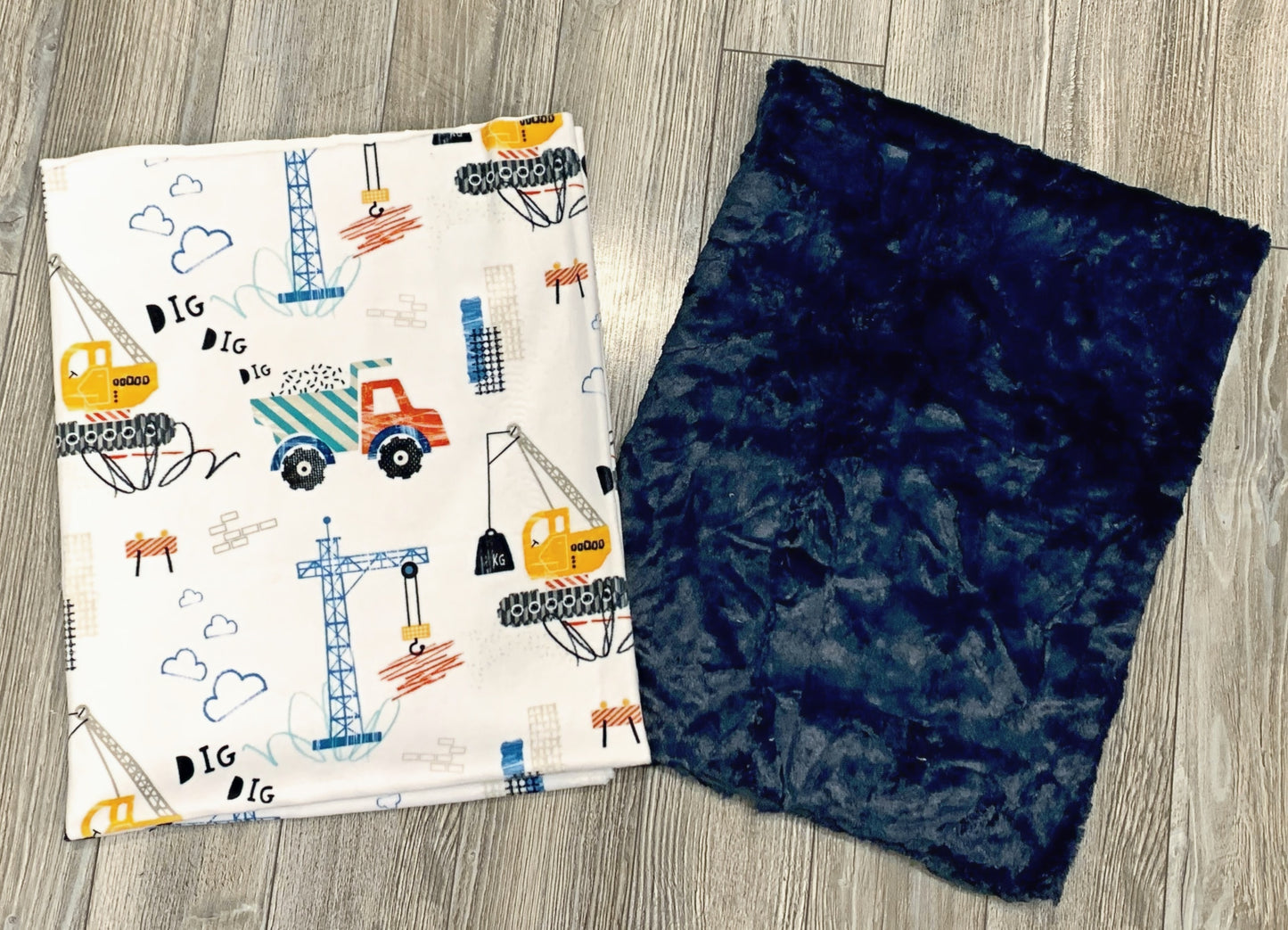 White and Navy Construction Vehicles