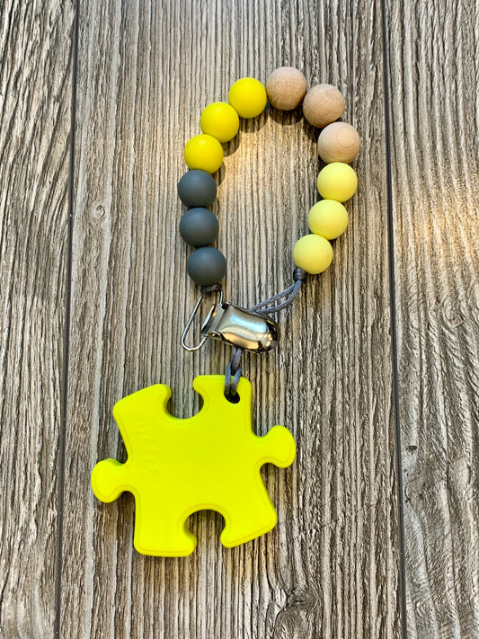 Soother Clip with Yellow Puzzle Teether