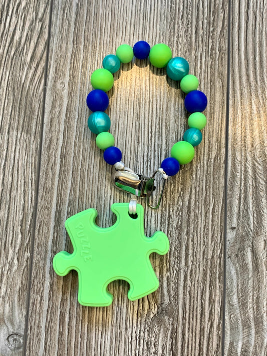 Soother Clip with Green Puzzle Teether